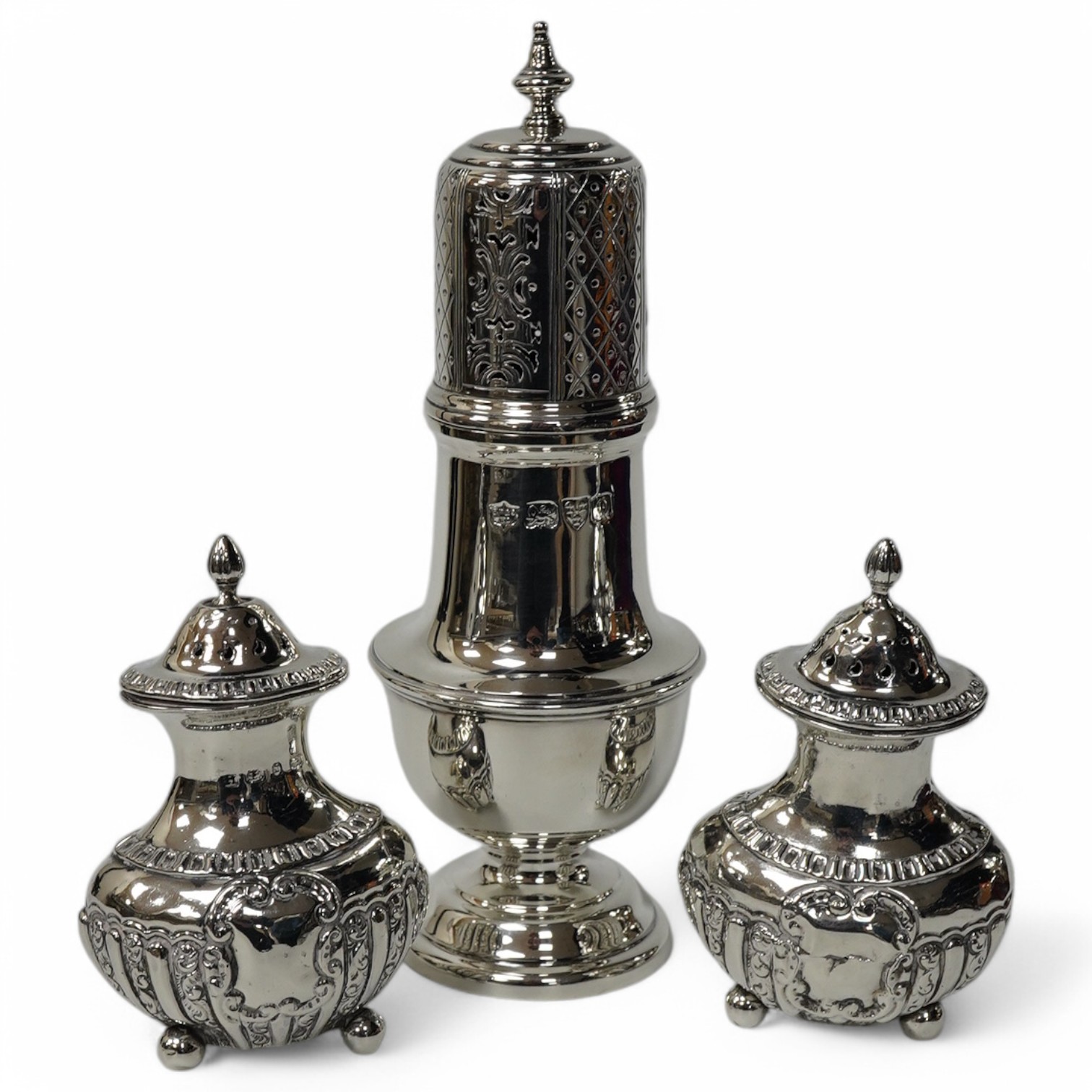 A George V silver sugar castor, by S. Blanckensee & Sons Ltd, Chester, 1929, 15.9cm and a pair of small late Victorian silver pepperettes, 8.4oz. Condition - poor to fair